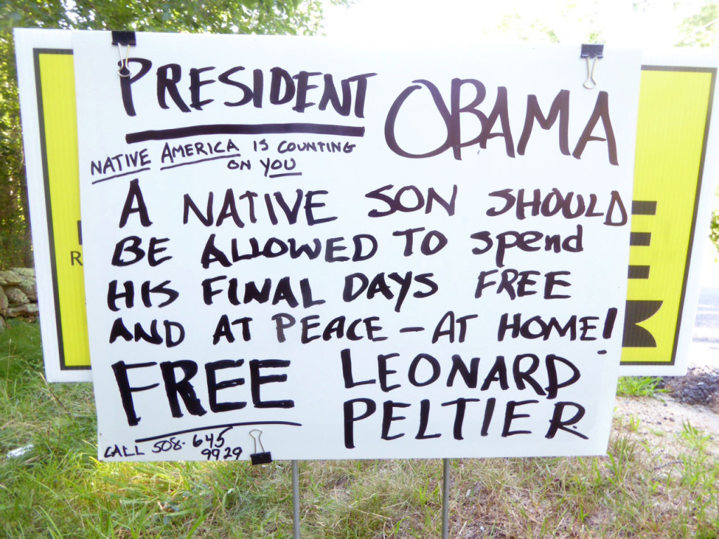 A sign posted on North Road asks President Obama to free Native American activist Leonard Peltier.